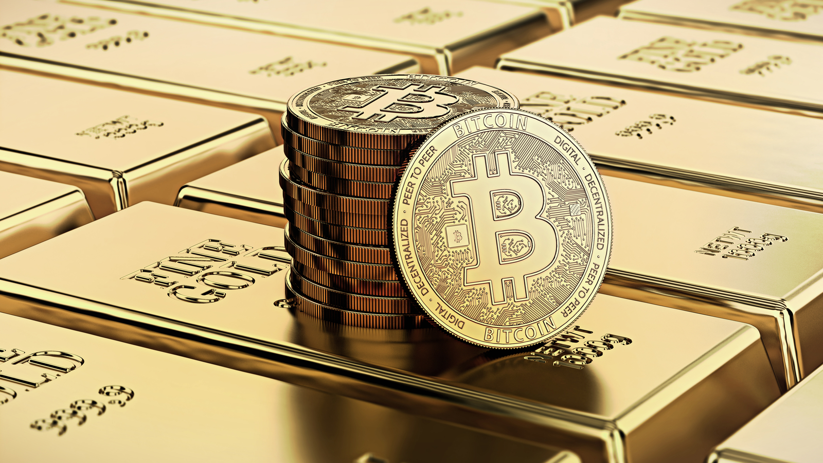 Bitcoin laying on stacked gold bars